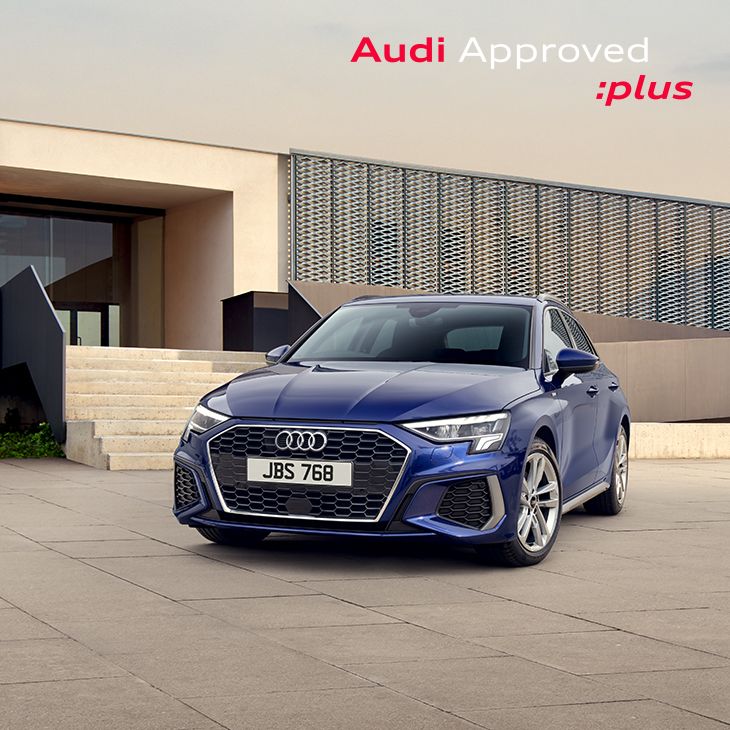 Audi serviceman working on car